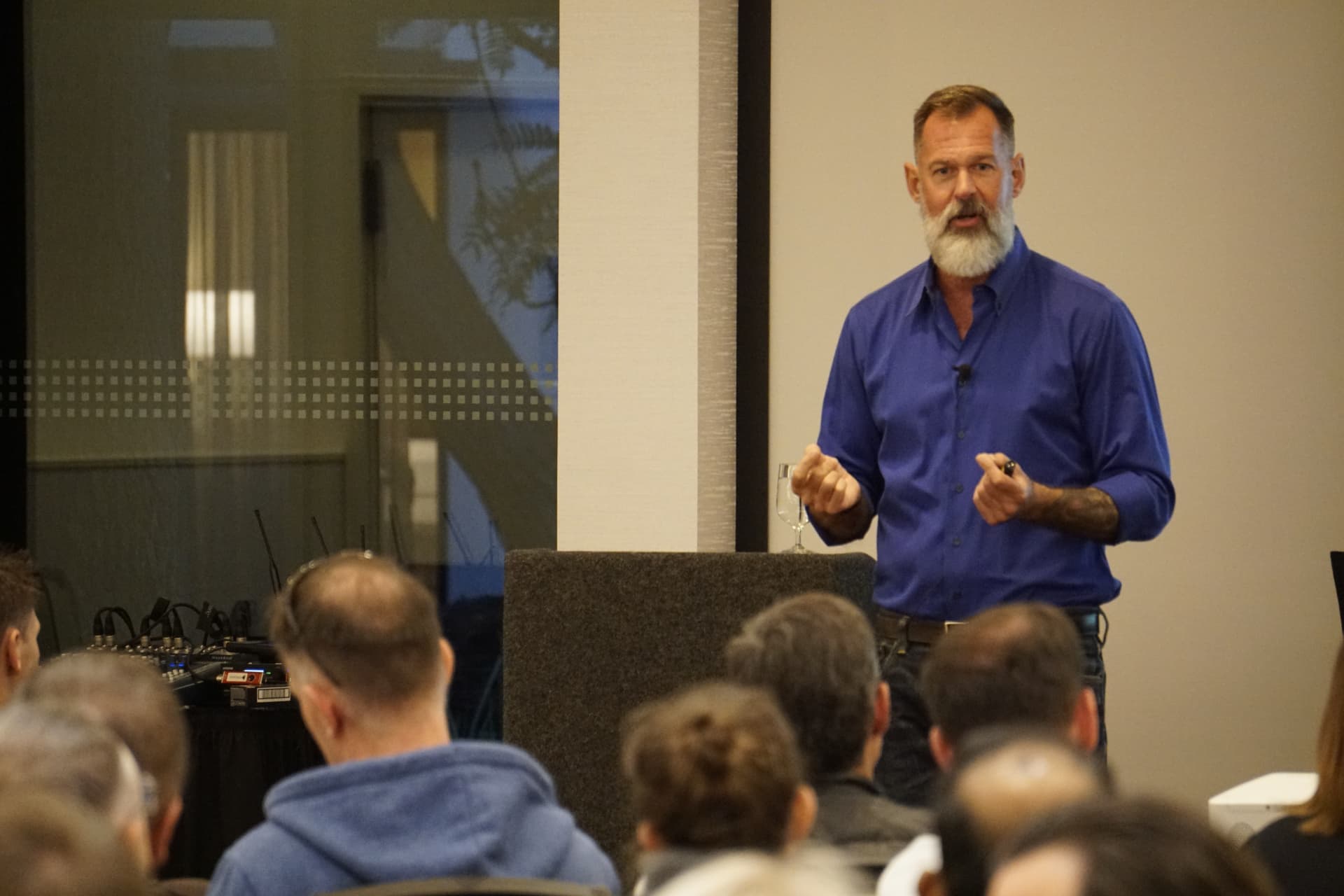 Alex speaking to a seated group
